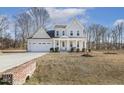 Beautifully landscaped two-story home with a spacious front yard and inviting curb appeal at 221 Old Hickory Dr, Raleigh, NC 27603