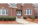 Brick front entrance with double doors and landscaping at 255 Dupree Rd, Willow Springs, NC 27592