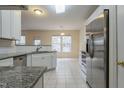 Spacious kitchen with granite countertops, stainless steel appliances, and white cabinets at 3124 Gross Ave, Wake Forest, NC 27587