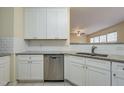 White shaker cabinets, granite countertops, and stainless steel dishwasher at 3124 Gross Ave, Wake Forest, NC 27587