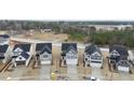 A view of the exterior elevation of new construction homes featuring traditional architecture and attached garages at 45 Nimble Way # 180, Clayton, NC 27520