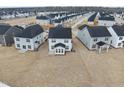 A rear aerial view showcasing a neighborhood's similar new construction homes and well-maintained landscapes at 45 Nimble Way # 180, Clayton, NC 27520