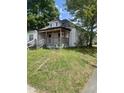 Classic single-story home with a front porch, showcasing its traditional architectural design and lawn at 614 Tucker St, Burlington, NC 27215