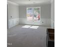 Spacious living room with decorative molding, natural light, and awaiting personalization for a comfortable home at 65 Watermelon Dr, Franklinton, NC 27525