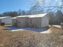 Rear view of house with AC unit and satellite dish at 903 N Park Rd, Burlington, NC 27217