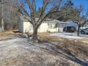 House with mature tree and snowy yard at 903 N Park Rd, Burlington, NC 27217