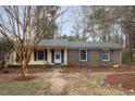 Brick ranch house with a landscaped yard at 101 Monterey Ln, Durham, NC 27713