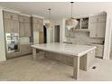 Spacious kitchen with a large island, custom cabinetry, and modern finishes at 109 Evander Way, Pittsboro, NC 27312