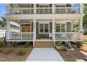 Inviting exterior view showcasing the building's double porches supported by stately columns at 1300 Broad St # A, Durham, NC 27705