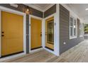 Two mustard yellow doors and a wooden deck at 1300 Broad St # B, Durham, NC 27705
