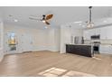 Open concept living area with hardwood floors and island kitchen at 1300 Broad St # C, Durham, NC 27705