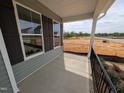 View from the covered porch; the perfect place to sit and relax at 19 Grassland Dr, Garner, NC 27529