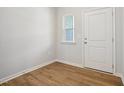 Bright foyer with wood-look floors and neutral walls at 2006 Regal Dr # 85, Durham, NC 27703