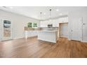 Modern kitchen with white cabinets, island, and stainless steel appliances at 2006 Regal Dr # 85, Durham, NC 27703