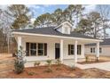 Newly built home with front porch at 305 E Pope Ave, Kenly, NC 27542