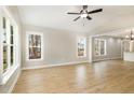 Bright living room featuring hardwood floors, neutral walls and large windows at 307 E Pope Ave, Kenly, NC 27542