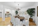 Elegant dining room with chandelier lighting and space for large gatherings at 3701 Baron Cooper Pass # 205, Raleigh, NC 27612