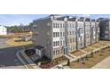 Aerial view of townhome community showing building exteriors and landscaping at 414 Gaston Park Ln # 100, Wake Forest, NC 27587
