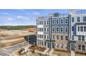 Aerial view of townhome community showcasing building exteriors at 414 Gaston Park Ln # 100, Wake Forest, NC 27587