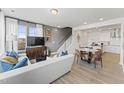 Open living room and kitchen with modern decor and large windows at 414 Gaston Park Ln # 100, Wake Forest, NC 27587