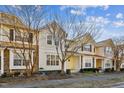 Row of townhouses with light beige siding and stone accents at 4108 Cherry Blossom Cir, Durham, NC 27713