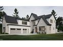 Two-story home exterior with neutral siding and a three car garage at 4112 Rockingham Dr, Raleigh, NC 27609