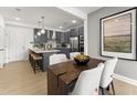 Modern kitchen with gray cabinets and stainless steel appliances at 412 Gaston Park Ln # 100, Wake Forest, NC 27587