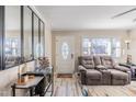 Living room with hardwood floors and comfortable seating at 424 Hawthorne Ln, Burlington, NC 27215