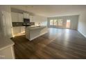 Open concept kitchen with island and stainless steel appliances at 5002 Cambrey Dr # 2, Durham, NC 27703