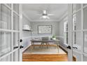 Bright office space with hardwood floors, natural light, and neutral paint provides a quiet workspace at 7416 Capulin Crest Dr, Apex, NC 27539