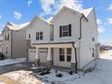 Two-story house with white siding, stone accents, and a two-car garage at 800 Summit Crest Ct, Apex, NC 27523