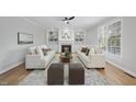 Inviting living room with a cozy fireplace, built-in bookshelves, and comfortable seating at 109 Aspenridge Dr, Holly Springs, NC 27540