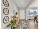 Bright entryway with a console table and decorative wall art at 148 Aylebury Rdg, Zebulon, NC 27597