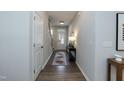 Bright and airy entryway with a console table and rug at 2371 Kettle Falls Sta, Apex, NC 27502