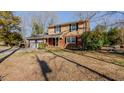 Ranch style brick house with attached garage, partially visible fenced backyard at 3042 Marlborough Rd, Burlington, NC 27215