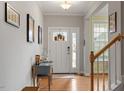 Bright and airy entryway with hardwood floors and a view of the staircase at 316 Granite Cove Ct, Rolesville, NC 27571