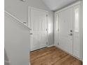 Bright entryway with hardwood floors, leading to interior rooms at 3838 Potecasi Dr, Raleigh, NC 27610