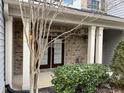 Townhouse front entrance with brick accents and double doors at 4972 Highcroft Dr, Cary, NC 27519