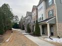 Row of townhouses with walkways and landscaping at 4972 Highcroft Dr, Cary, NC 27519