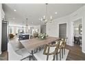 Open concept kitchen and dining area with an island and modern appliances at 608 Market Grove Dr # 200, Wake Forest, NC 27587