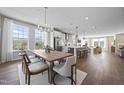 Open concept kitchen, dining, and living area with hardwood floors at 608 Market Grove Dr # 200, Wake Forest, NC 27587