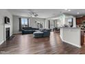 Spacious living room with fireplace, sectional sofa, and hardwood floors at 655 Hawksbill Dr, Franklinton, NC 27525