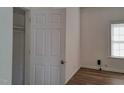 Simple bedroom with wood flooring and a closet at 723 S Washington St, Rocky Mount, NC 27801