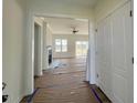 Bright entryway revealing an open-concept living space, complete with a fireplace and large windows at 899 Olive Branch Dr, Smithfield, NC 27577