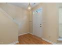 Bright foyer with hardwood floors and staircase at 1031 Lake Moraine Pl, Raleigh, NC 27607