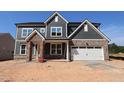 New two-story home with stone and siding details and a two-car garage at 1104 Opal Ln # 104, Durham, NC 27705