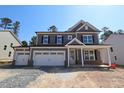 Charming two-story home with a three car garage and covered porch at 1109 Opal Ln # 71, Durham, NC 27705