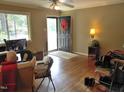 Living room features hardwood floors and a view of the front yard at 1414 Scales St, Raleigh, NC 27608