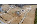 An aerial view of a large property with multiple buildings and a long private driveway at 14425 Nc-96 N Hwy, Zebulon, NC 27597