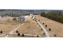 Aerial view showcasing a large estate, long driveways, and surrounding landscape at 14425 Nc-96 N Hwy, Zebulon, NC 27597